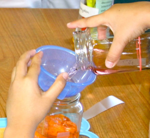 student pouring to measure photo